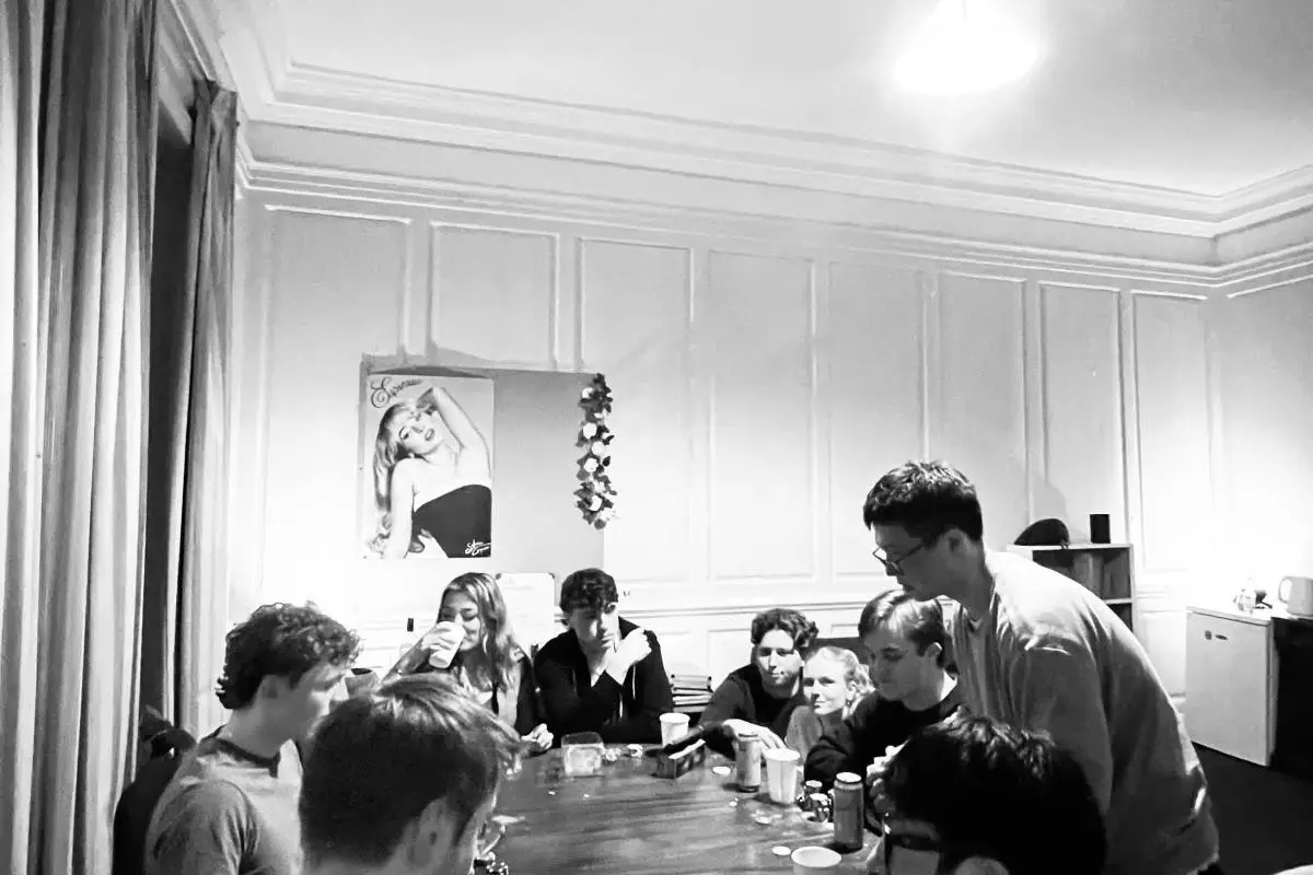 Members of the Poker society sat around a table playing Poker